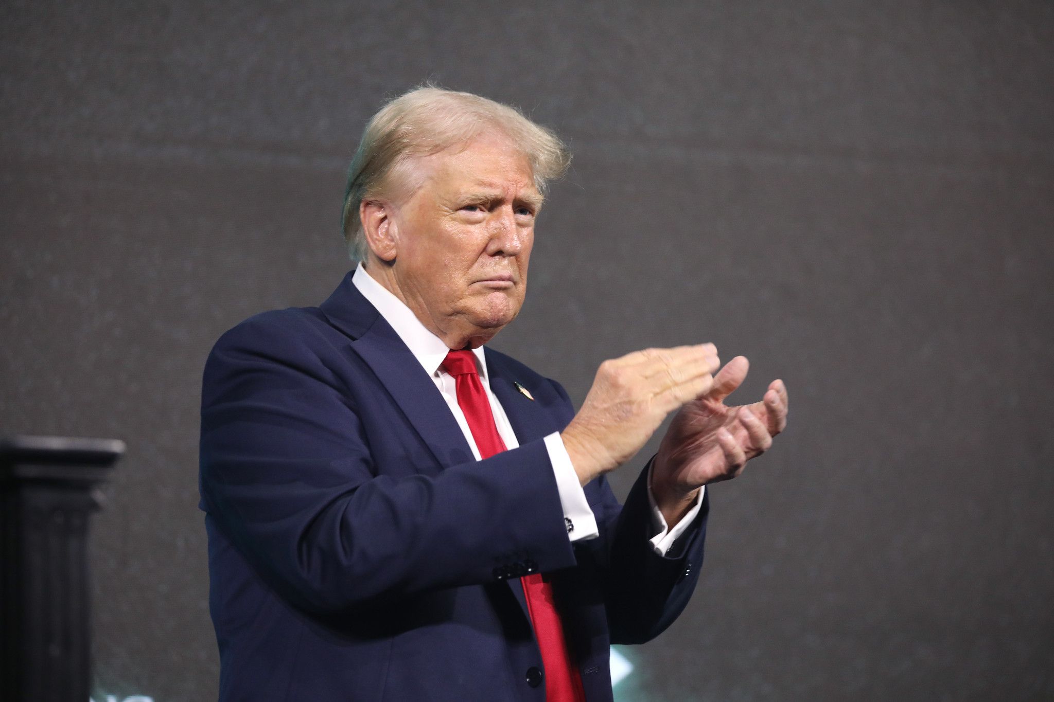 Former President of the United States Donald Trump speaking with attendees at The Believers Summit at the Palm Beach County Convention Center in West Palm Beach, Florida.