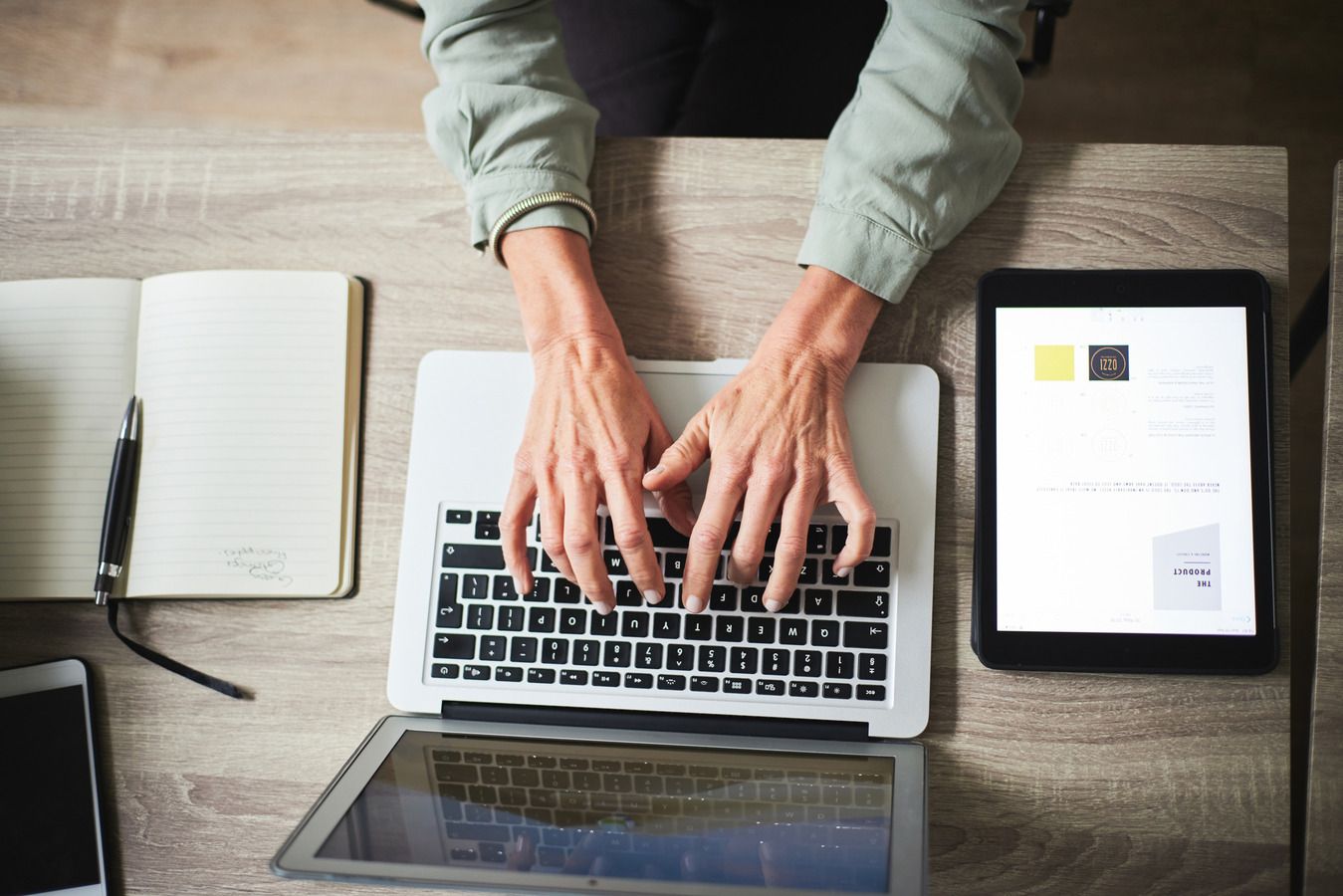 Computer, planning and person hands in digital marketing, copywriting ideas and online research above. Laptop, notebook and screen of people typing on desk for social media, blog or creative business.