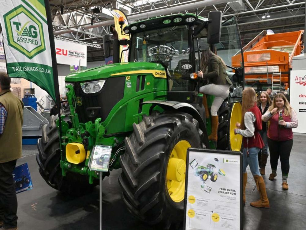 Visitors view a John Deere 6R 185 tractor during the LAMMA Show 2025 at NEC Birmingham on January 15, 2025 in Birmingham, England. (Photo by John Keeble/Getty Images)