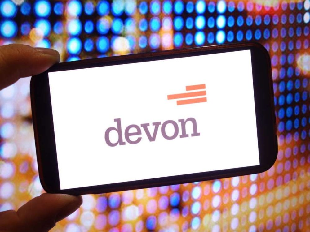 In this photo illustration, the Devon Energy company logo is seen displayed on a smartphone screen. (Photo Illustration by Piotr Swat/SOPA Images/LightRocket via Getty Images)