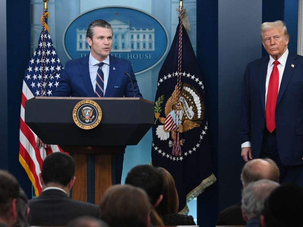 U.S. defense secretary Pete Hegseth (L) speaking with reporters beside Donald Trump. (Photo by Chen Mengtong/China News Service/VCG via Getty Images)