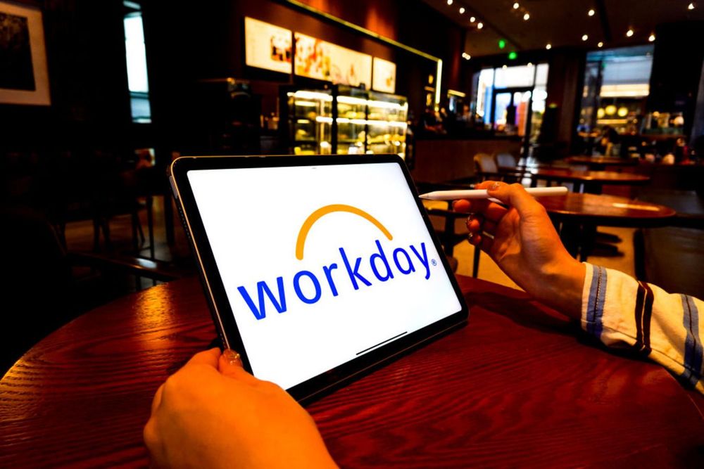 Workday logo is displayed on the screen of an iPad.
