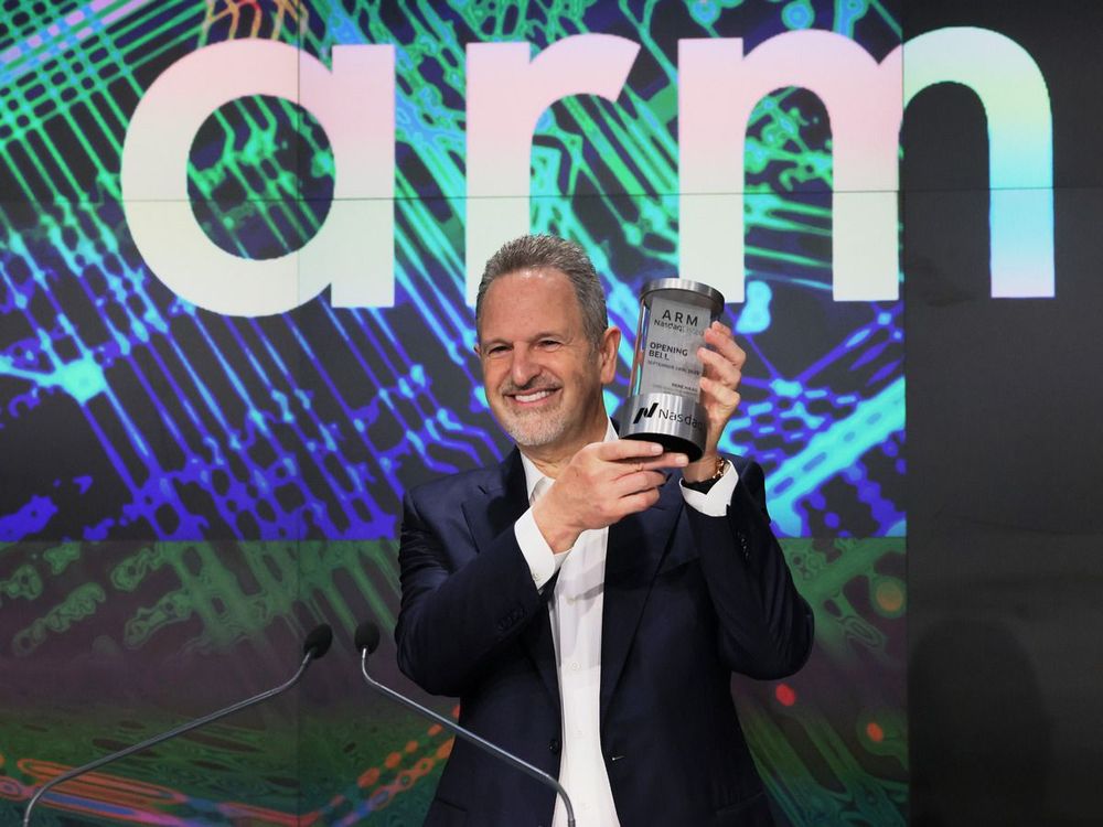 Arm Holdings CEO Rene Haas poses with the Opening Bell Crystal at the Nasdaq MarketSite.