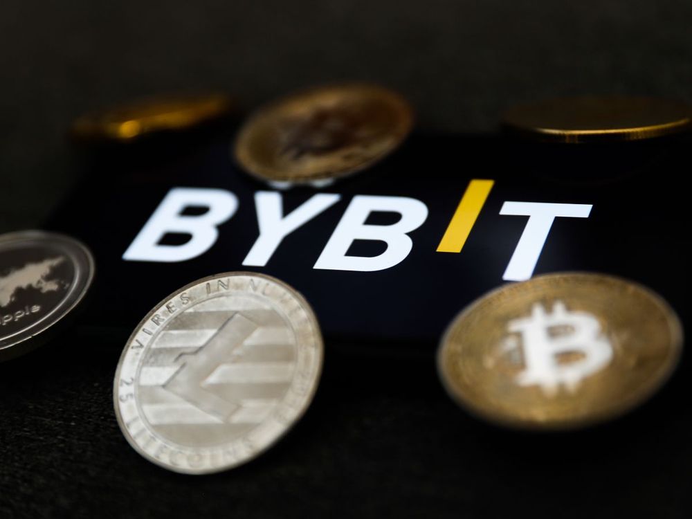 Bybit logo displayed on a phone screen and representation of cryptocurrency are seen in this illustration photo taken in Krakow, Poland on February 16, 2022. (Photo illustration by Jakub Porzycki/NurPhoto via Getty Images)
