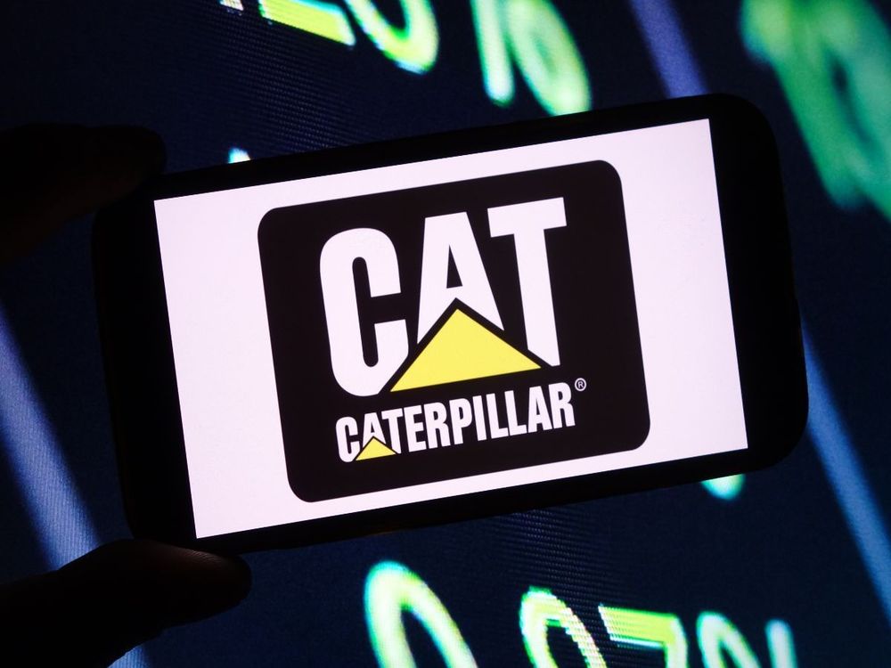 In this photo illustration, the Caterpillar company logo is seen displayed on a smartphone screen. (Photo Illustration by Piotr Swat/SOPA Images/LightRocket via Getty Images)