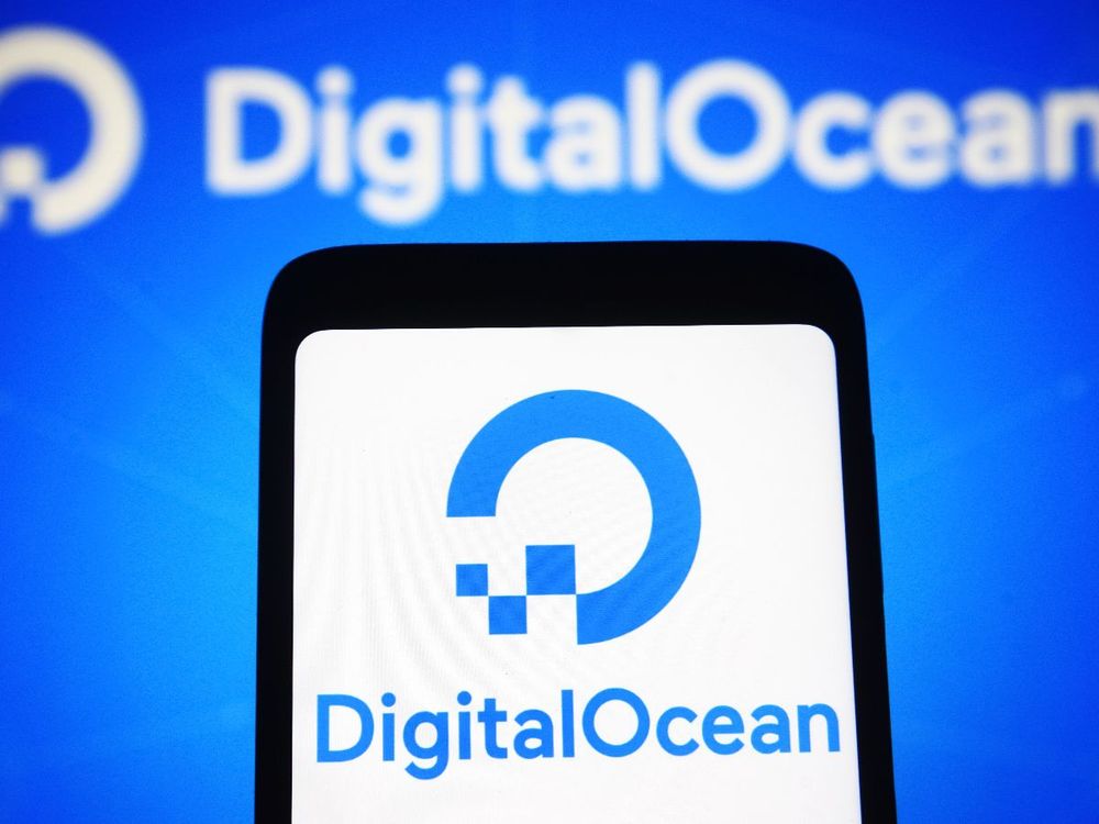 In this photo illustration, a DigitalOcean Inc. logo is seen on a smartphone screen and in the background. (Photo Illustration by Pavlo Gonchar/SOPA Images/LightRocket via Getty Images)