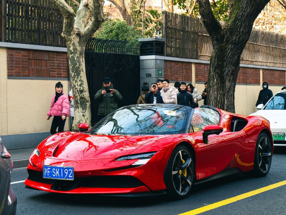 High-end vehicle drives on Wukang Road on Jan. 11, 2025 in Shanghai, China. Visitors from around the world are flocking to Wukang Road to catch a glimpse of the luxury car show. (Photo by Wu Wei/VCG via Getty Images)