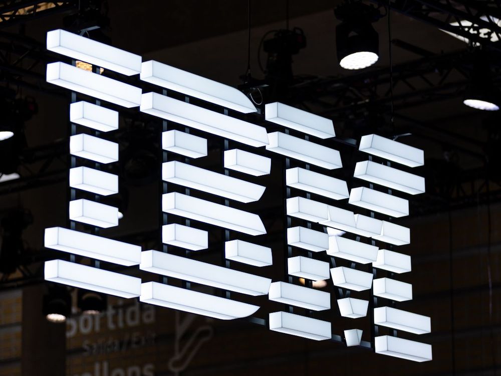 A logo sits illuminated at the IBM booth at Mobile Congress 2025 on March 06, 2025 in Barcelona, Spain. (Photo by Eric Alonso/Getty Images)