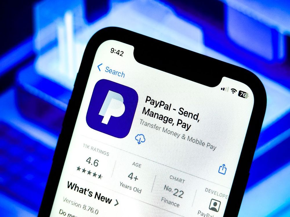 In this photo illustration, a PayPal app logo is displayed on an iPhone in the Apple Store. (Photo Illustration by Sheldon Cooper/SOPA Images/LightRocket via Getty Images)