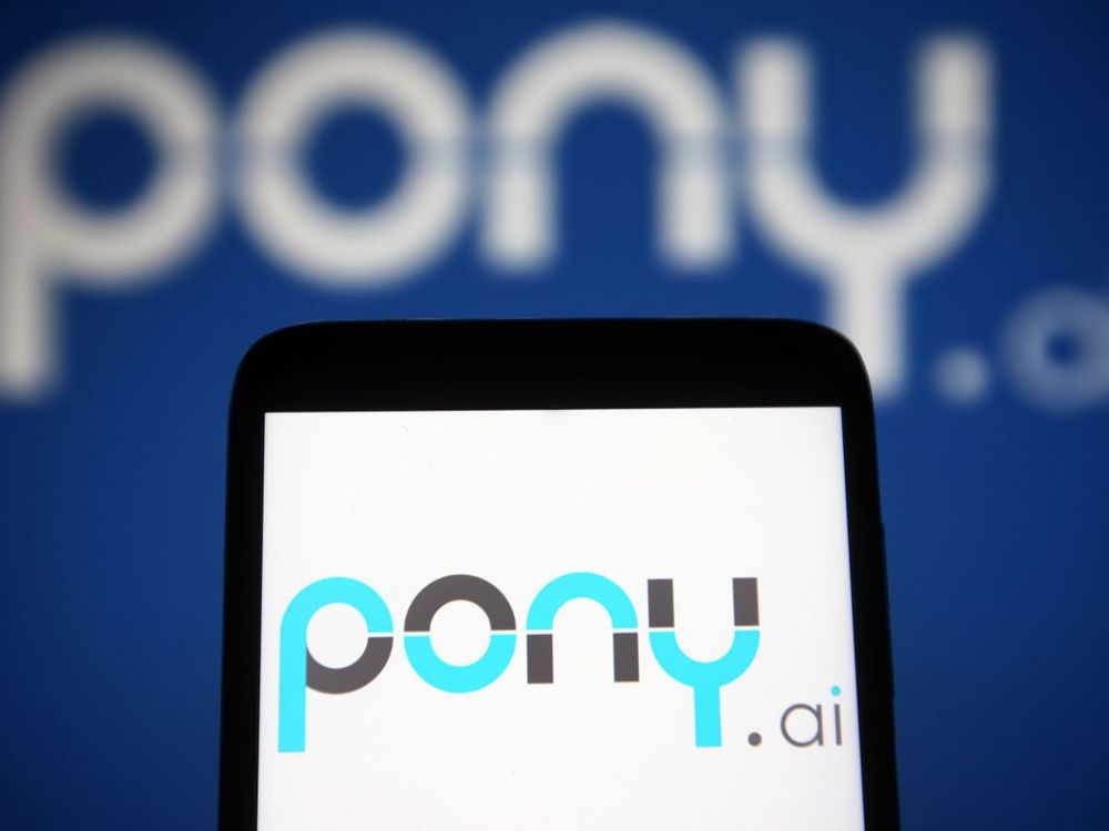 In this photo illustration a Pony.ai logo of an autonomous vehicle technology company is seen on a smartphone and a pc screen. (Photo Illustration by Pavlo Gonchar/SOPA Images/LightRocket via Getty Images)