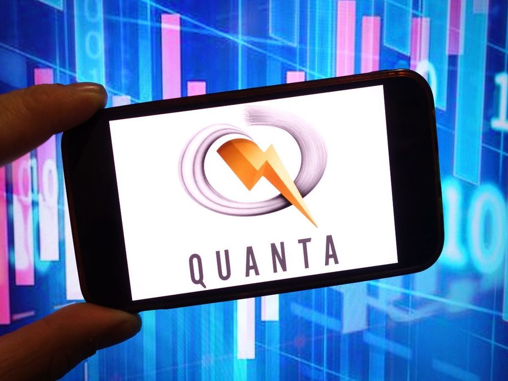 In this photo illustration, the Quanta Services company logo is seen displayed on a smartphone screen. (Photo Illustration by Piotr Swat/SOPA Images/LightRocket via Getty Images)