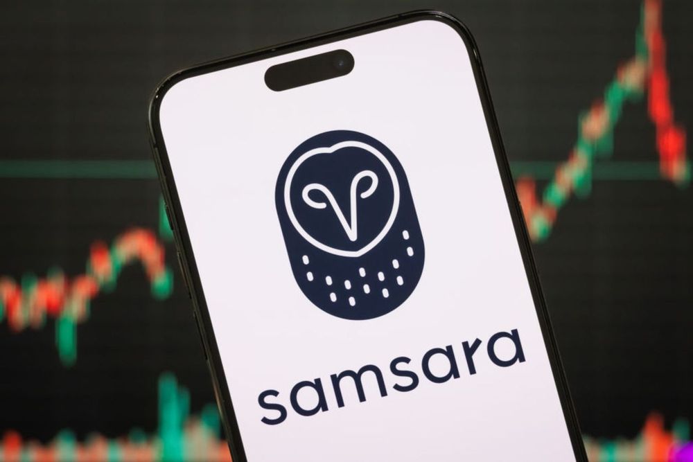In this photo illustration, the Samsara logo is displayed on a smartphone screen, with financial charts and stock market performance visible in the background, on March 3, 2025, in Chongqing, China.