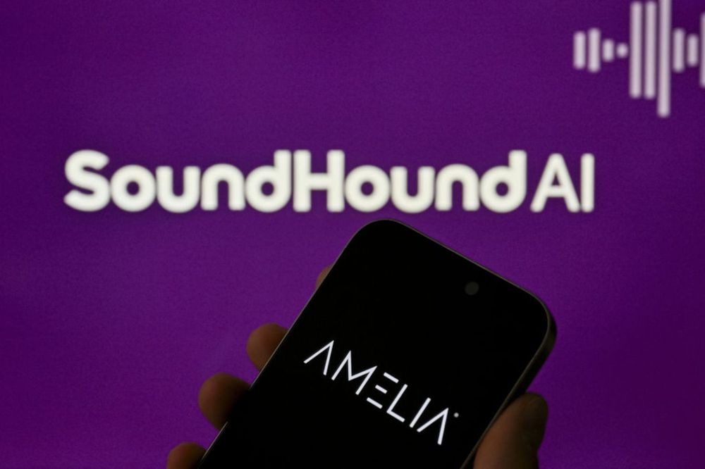 Amelia logo is being displayed on a mobile phone screen in front of a monitor displaying SoundHoundAI logo in Ankara, Turkiye on August 27, 2024. 