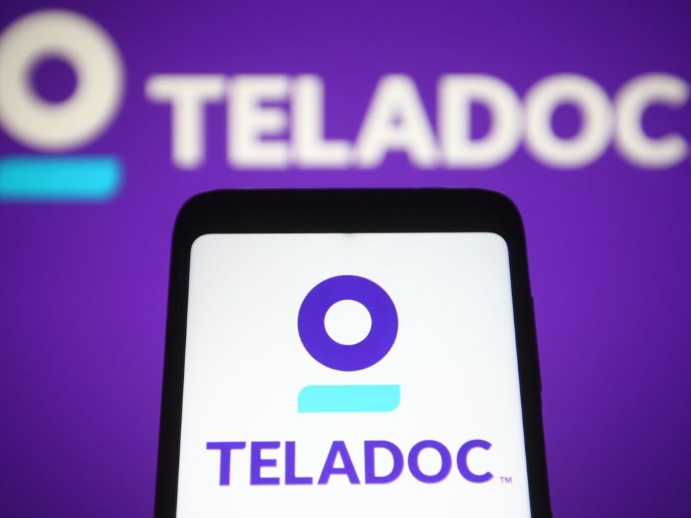 In this photo illustration, a Teladoc logo is seen on a smartphone screen and in the background. (Photo Illustration by Pavlo Gonchar/SOPA Images/LightRocket via Getty Images)
