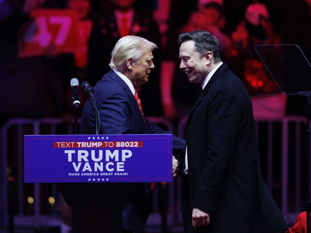Tesla Founder Elon Musk walks on stage with his son, X, beside President-elect Donald Trump during a rally at Capital One Arena in Washington, on January 19, 2025. (Photo by Tom Brenner for The Washington Post via Getty Images)