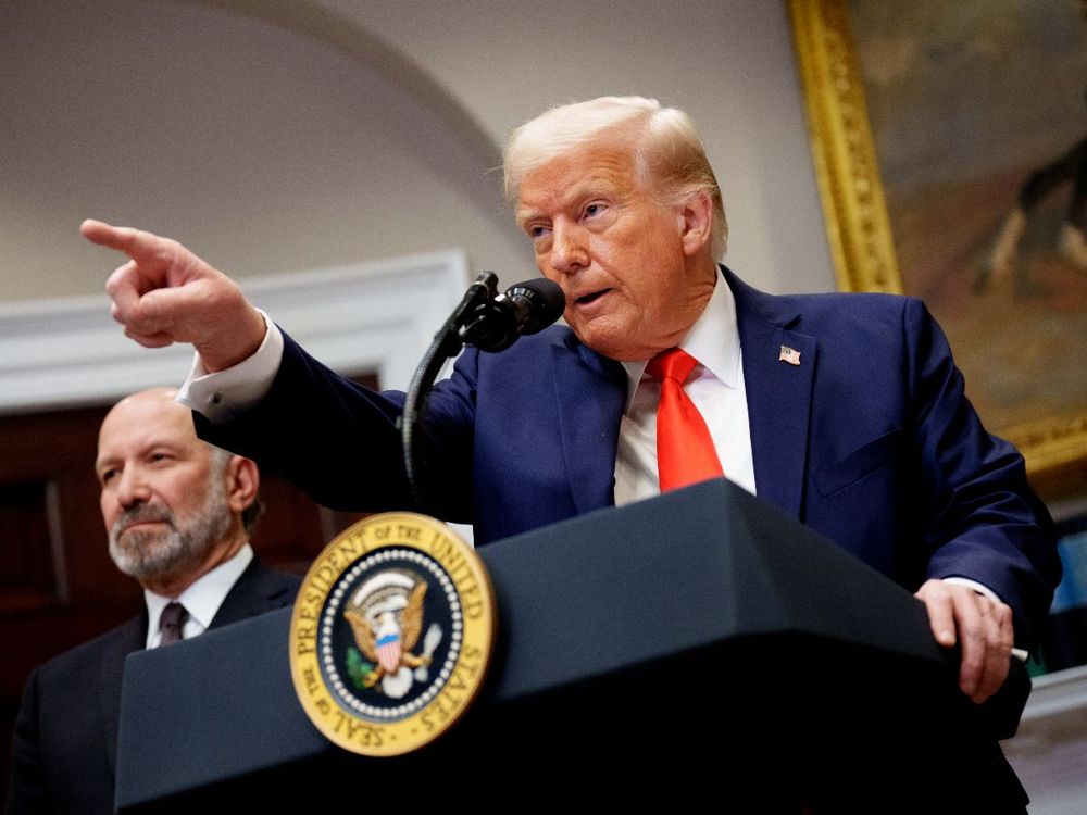 U.S. President Donald Trump, accompanied by Commerce Secretary Howard Lutnick (L) takes a question from a reporter in the Roosevelt Room of the White House on March 3, 2025 in Washington, DC. (Photo by Andrew Harnik/Getty Images)