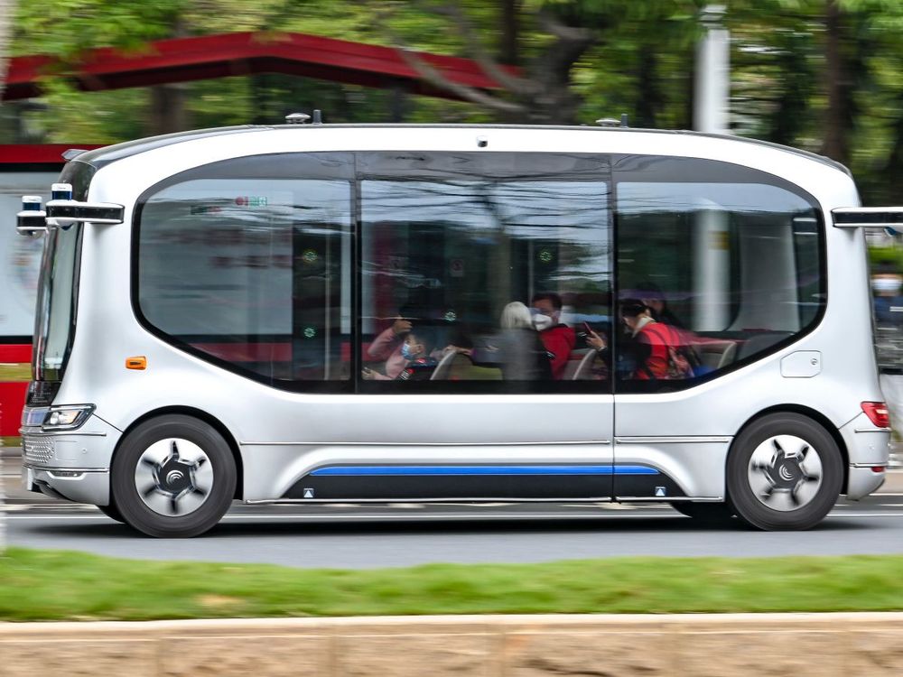 Citizens take a WeRide self-driving mini robobus for free at Guangzhou International Bio Island on January 9, 2022 in Guangzhou, Guangdong Province of China. (Photo by Chen Jimin/China News Service via Getty Images)